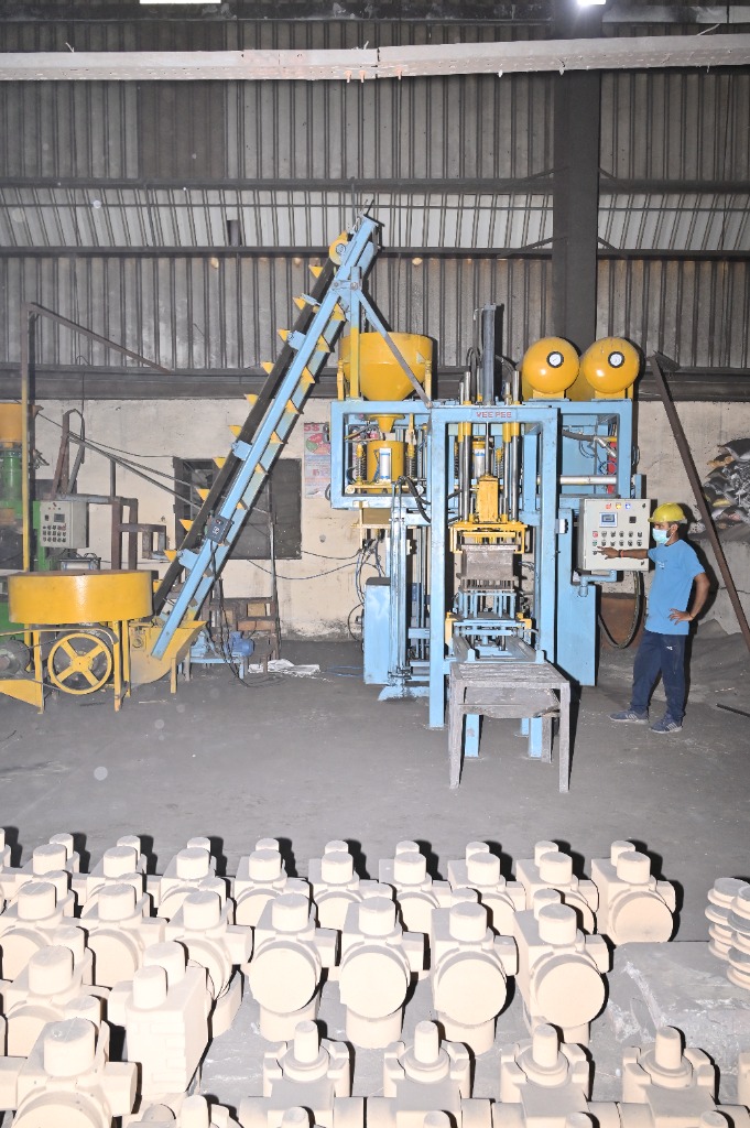 Professional sand core manufacturing plant line with finished cores in foreground