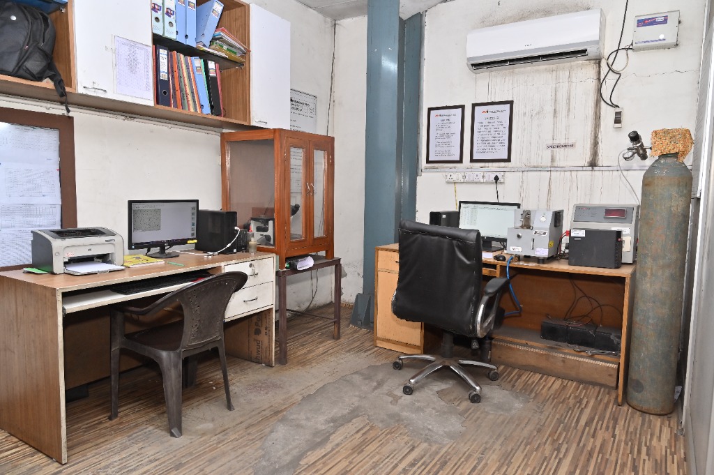 Panoramic view of metallurgical computers, workstations, spectrometer, and microscope equipment